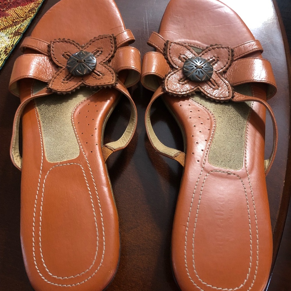 Cute  sandals rusty orange in color.